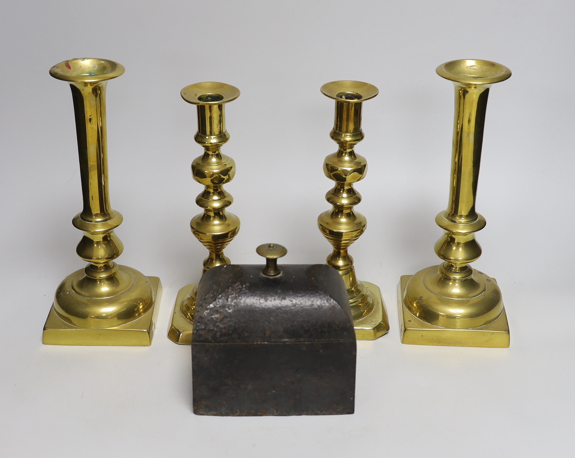 Two pairs of 19th century brass candlesticks and a Coalbrookdale iron tobacco box and cover, tallest candlesticks 24cm high